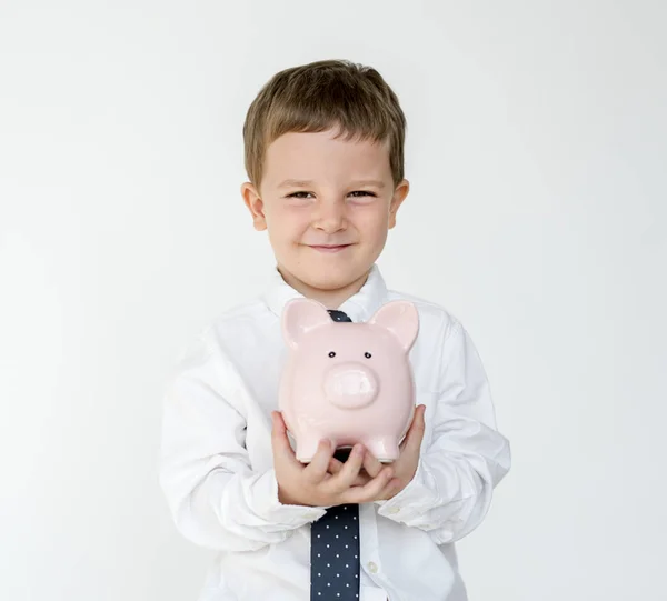 Baiat holding piggy bank — Fotografie, imagine de stoc