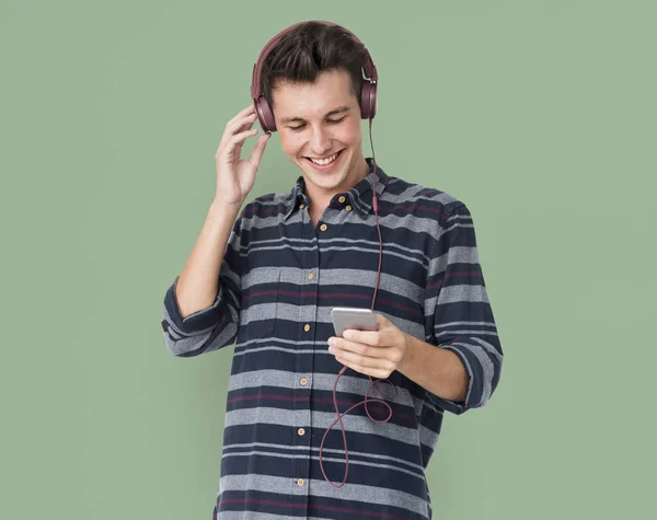 Man listening music in headphones — Stock Photo, Image