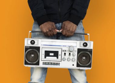 adam holding boombox