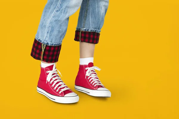 Foot in red sneakers — Stock Photo, Image
