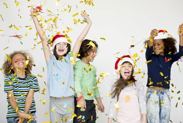 Children playing with confetti — Stock Photo, Image