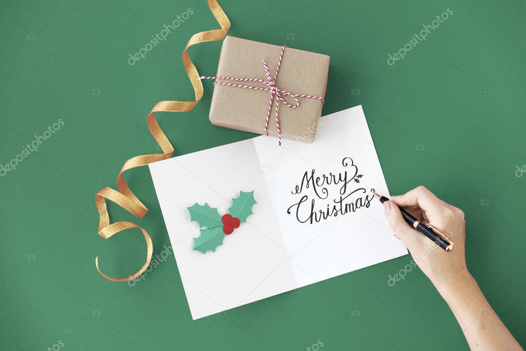 Person writing on greeting card