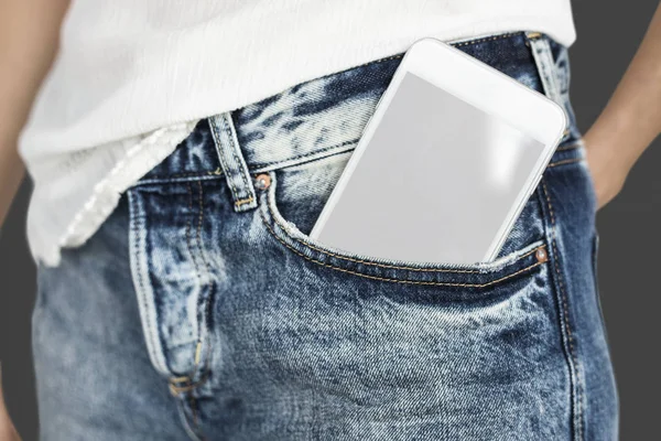 Mobile phone in humans trousers pocket — Stock Photo, Image