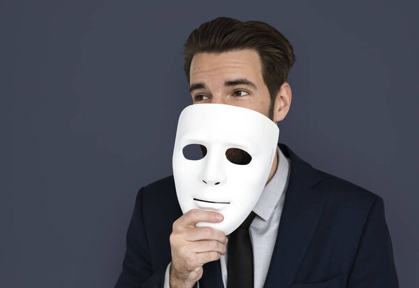 businessman covering face by mask
