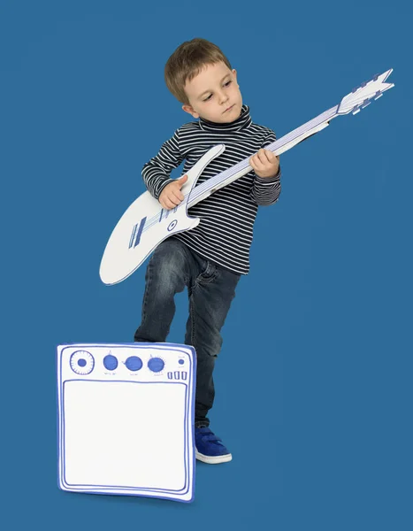 Boy playing on paper guitar — Stock Photo, Image