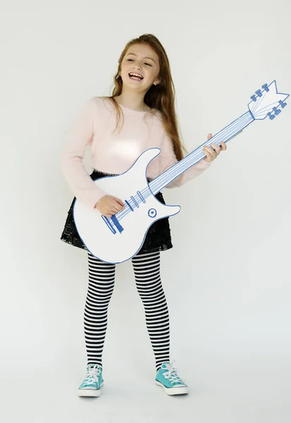 Girl playing on paper Guitar — Stock Photo, Image