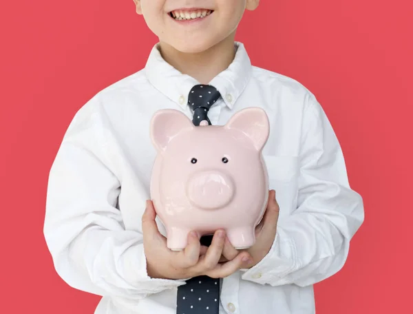 Menino segurando banco porquinho — Fotografia de Stock