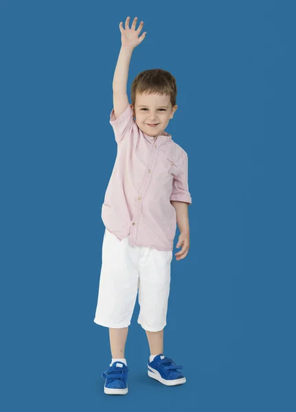 Boy držení ruky nahoru — Stock fotografie