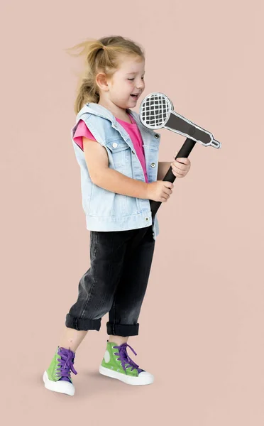 Girl  singing in paper microphone — Stock Photo, Image