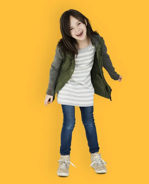 Girl in coat dancing in studio — Stock Photo, Image