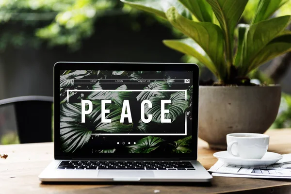 Laptop on wooden table in cafe — Stock Photo, Image