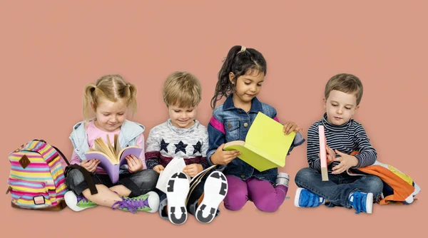 Preschool children with books and backpacks — Stock Photo, Image