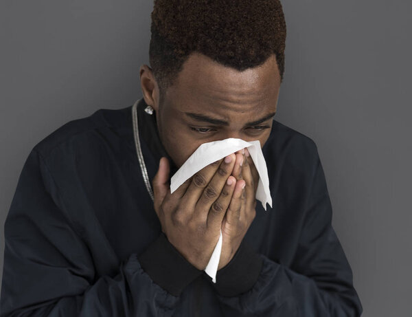 Young african man posing in studio