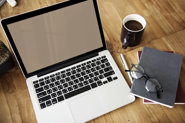 Opened laptop on workplace table — Stock Photo, Image