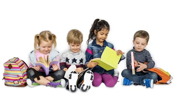 Preschool children with books and backpacks — Stock Photo, Image