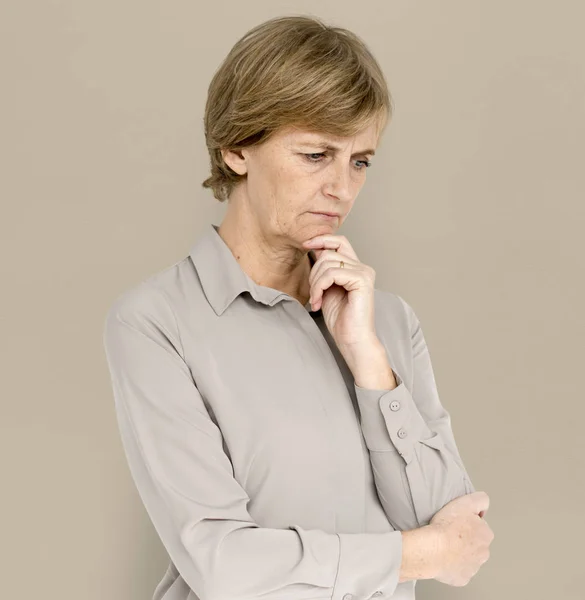 Thinking mature woman — Stock Photo, Image