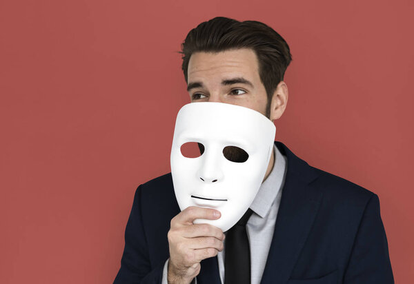 Businessman holding masks