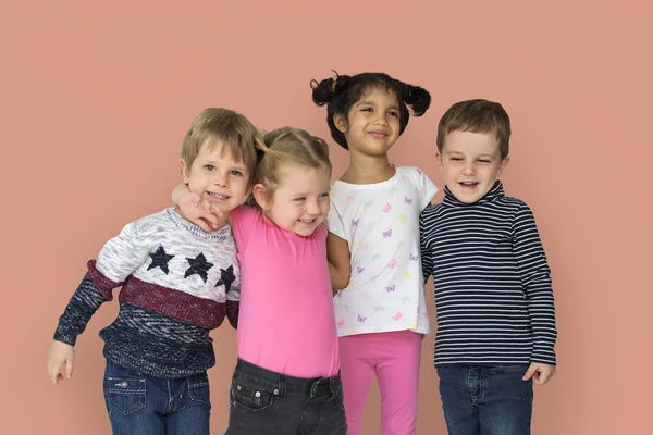 Beautiful children hugging in studio — Stock Photo, Image