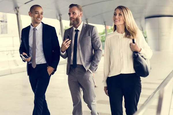 Businesspeople walking near each other — Stock Photo, Image