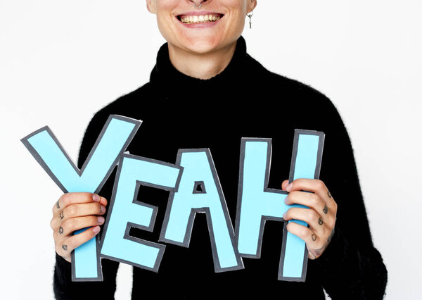 Blonde Woman holding word YEAH