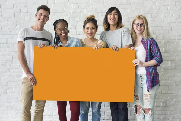 Friends holding banner together — Stock Photo, Image