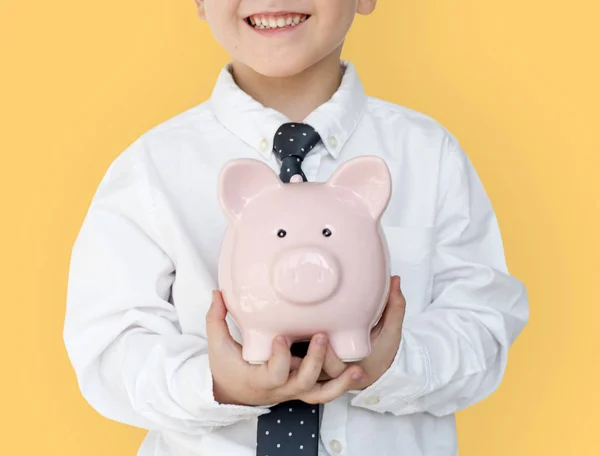 Rapaz segurando piggybank — Fotografia de Stock