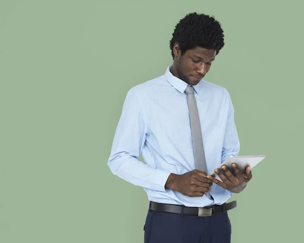 African Man browsing digital tablet — Stock Photo, Image