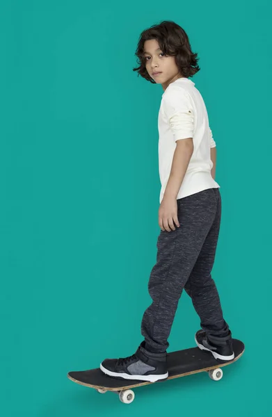 Stylish boy with skateboard — Stock Photo, Image