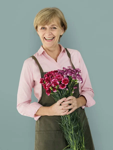 Caucasian mature Woman with Flowers — Stock Photo, Image