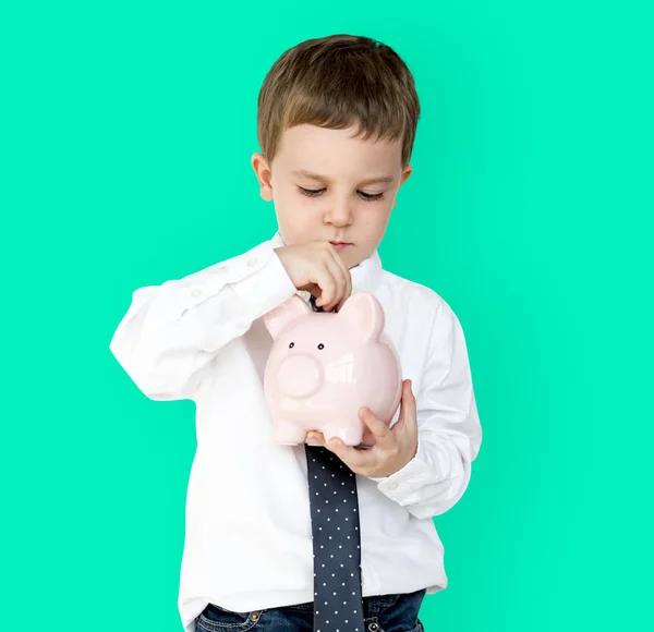 Rapaz segurando piggybank — Fotografia de Stock