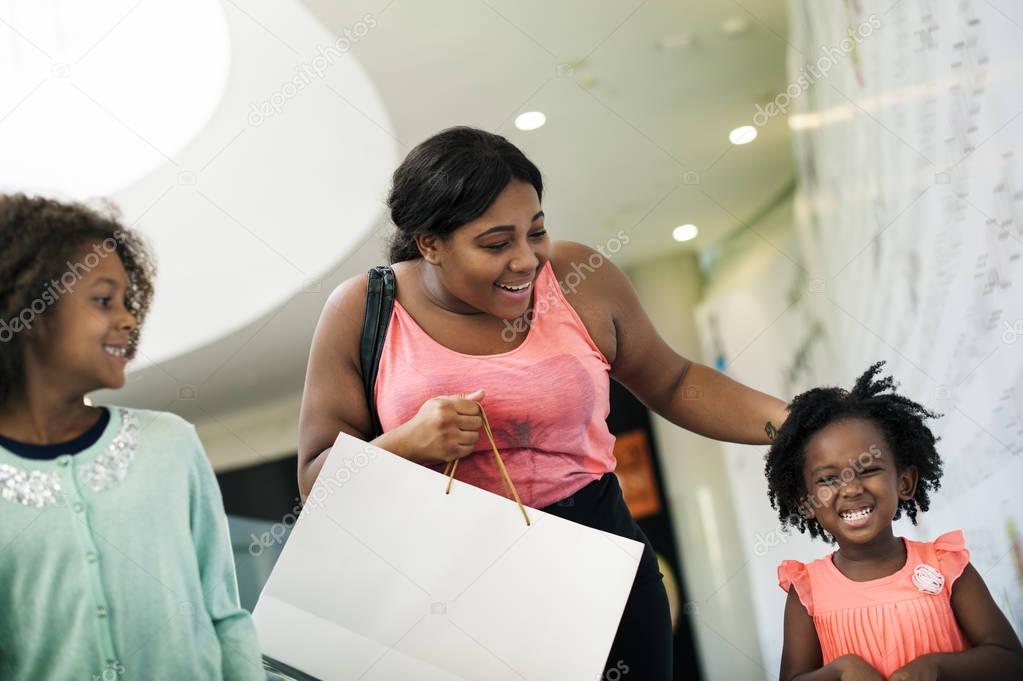 African family in shopping center