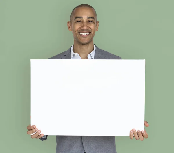 Businessman holding white placard — Stock Photo, Image