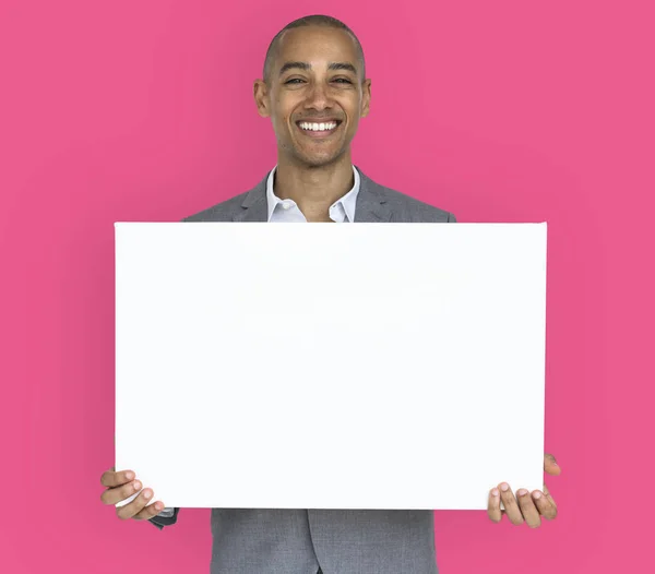 Businessman holding white placard — Stock Photo, Image