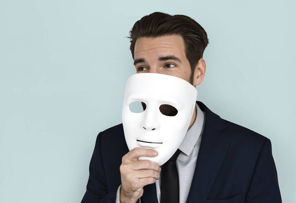 Businessman holding masks