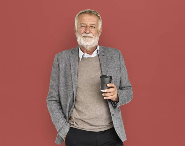 Man with beard holding coffee mug — Stock Photo, Image