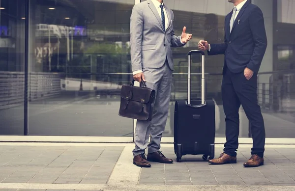 two Businessmen with luggage