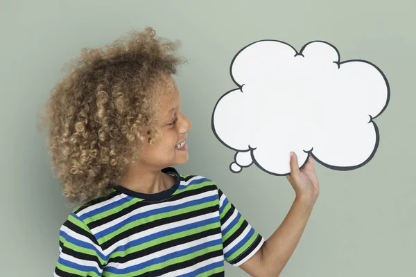 African boy holding speech bubble — Stock Photo, Image