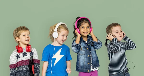 Children listening music in headphones — Stock Photo, Image