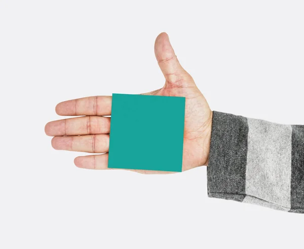 Menselijke hand bedrijf sticky pad — Stockfoto