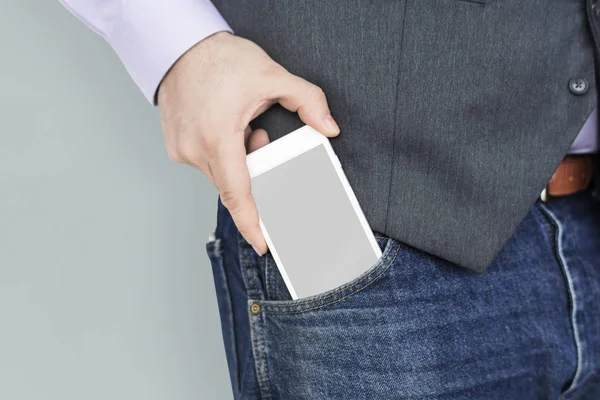 Teléfono móvil en el bolsillo — Foto de Stock