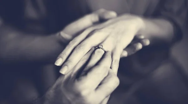 Man putting ring of female finger — Stock Photo, Image