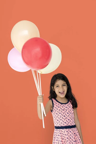 Menina segurando balões — Fotografia de Stock