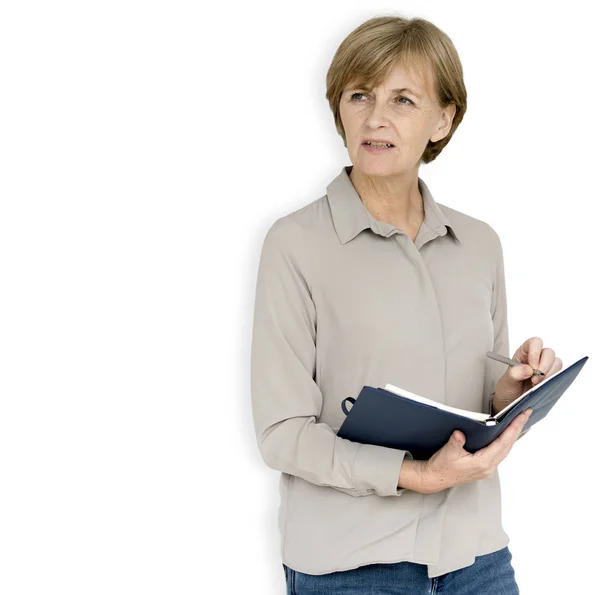 Mature woman with notebook — Stock Photo, Image