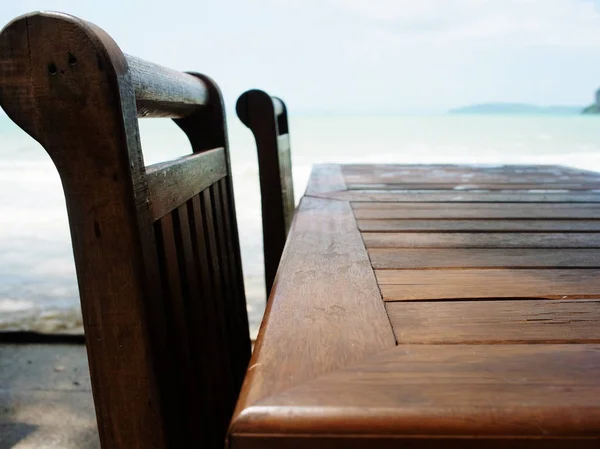 Chair at wooden table — Stock Photo, Image