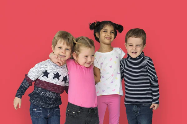 Beautiful children hugging in studio — Stock Photo, Image