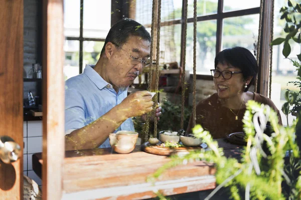 Mature couple having teatime — Stock Photo, Image