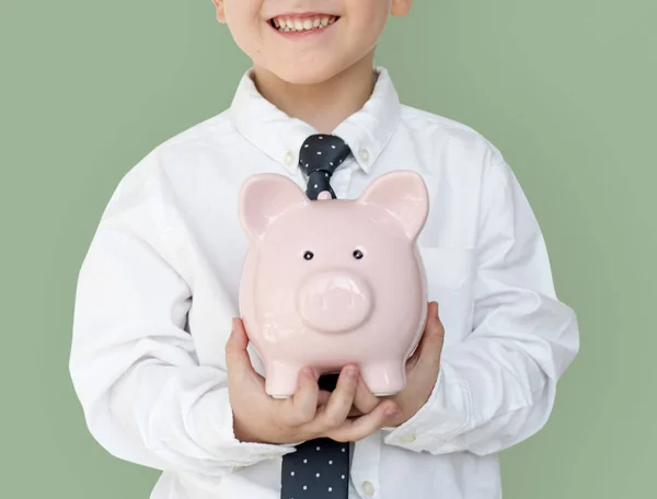 Rapaz segurando piggybank — Fotografia de Stock