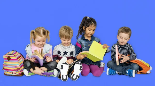 Preschool children with books and backpacks — Stock Photo, Image