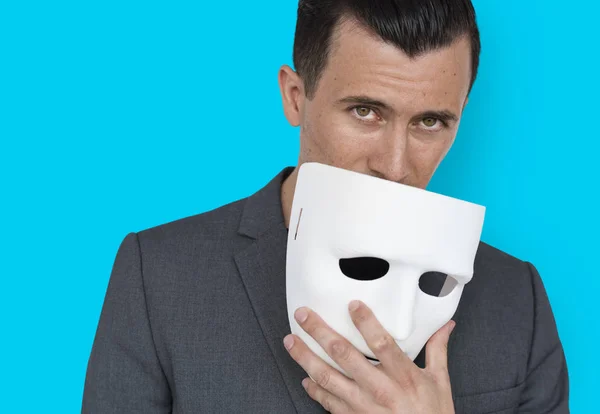 Man covering face by mask — Stock Photo, Image