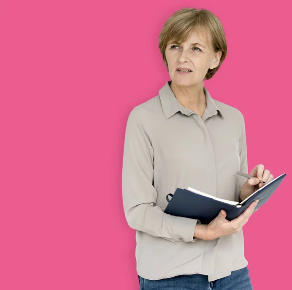 Mature woman with notebook — Stock Photo, Image